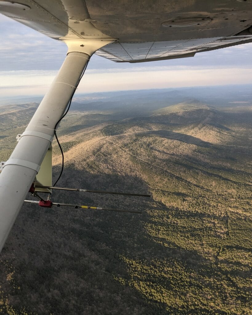 VHF antenna attached to the plane as flown over rugged mountains